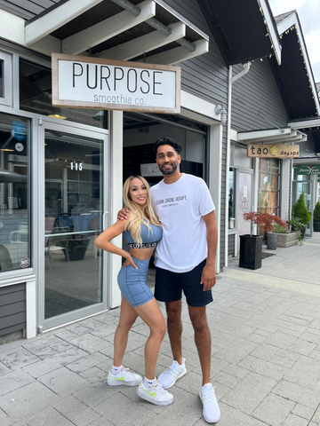 Elaine Li, founder of Livelite Athletica, posing next to Braeden the founder of Purpose Smoothie Co. A collaboration in August for an outdoor pop-up event for Purpose Smoothie Co's 5th year Anniversary.