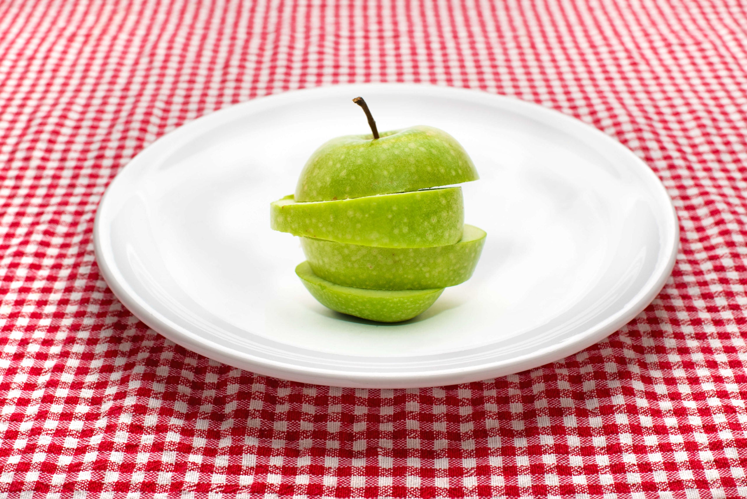 Restricted diet, an apple on a plate