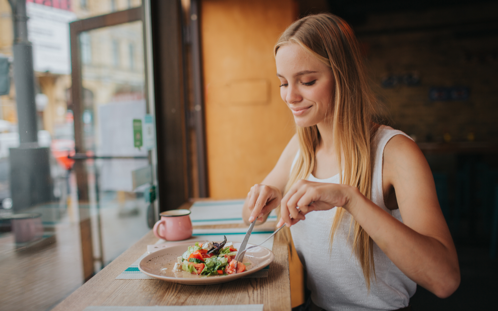 Woman eating salad