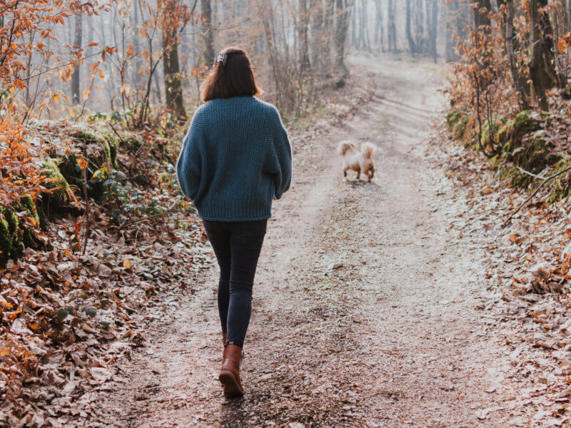 Woman walking in the woods