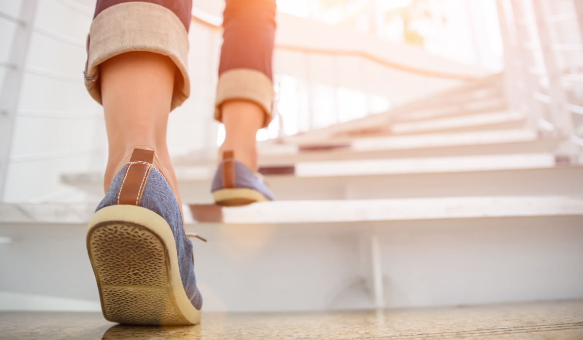 woman walking up stairs