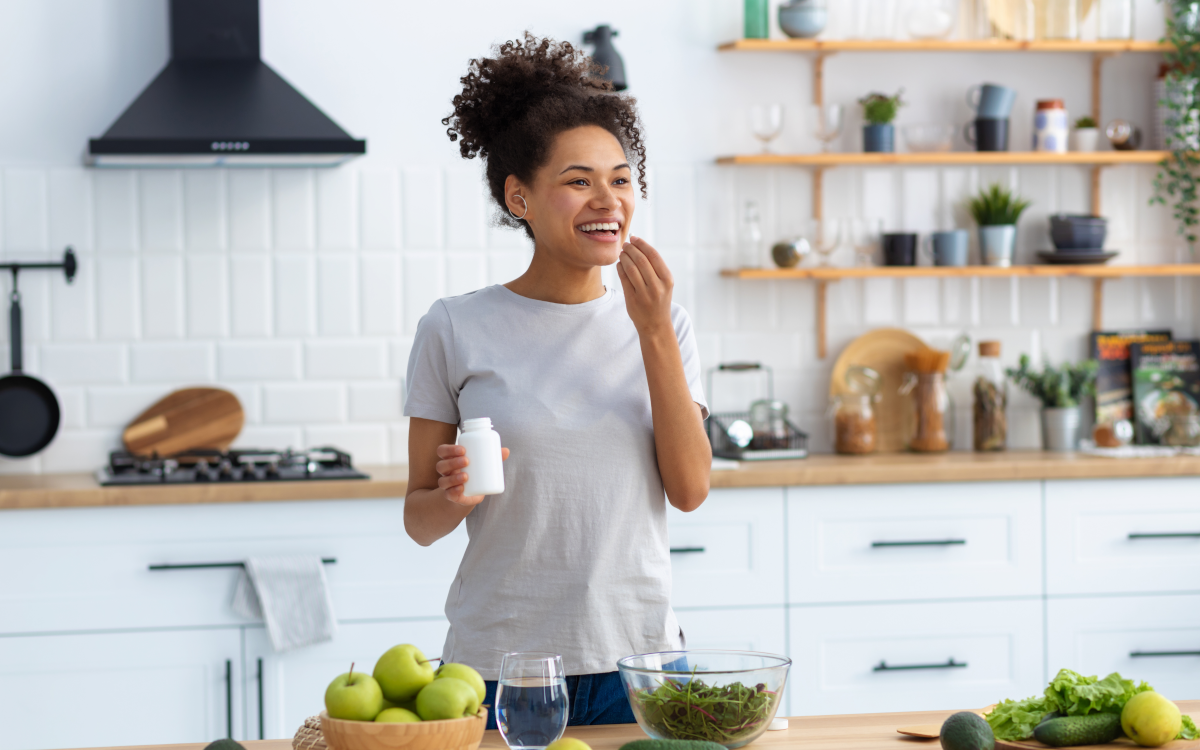 woman taking phenq supplement