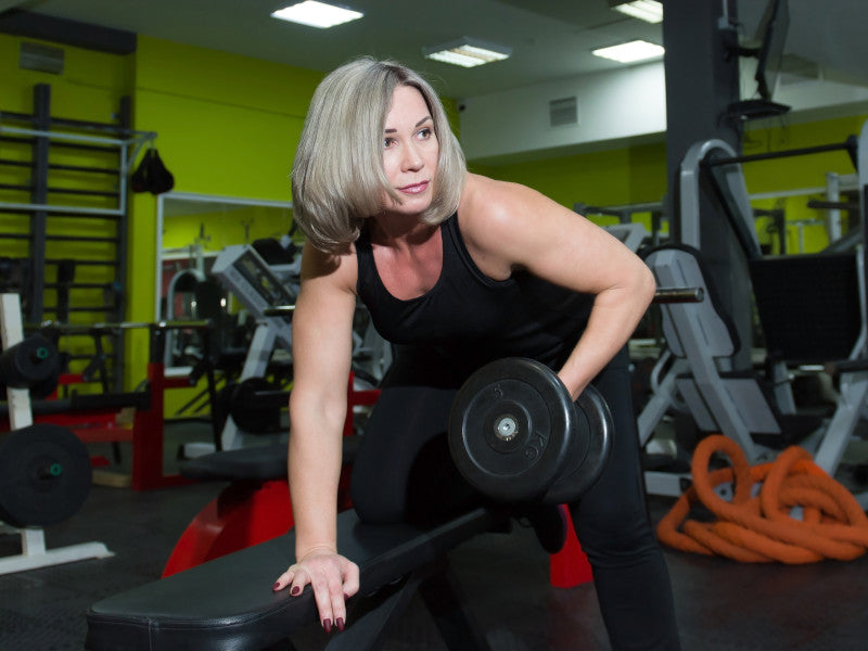 older woman exercising with weights