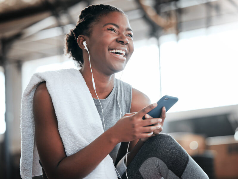 Woman listens to workout playlist