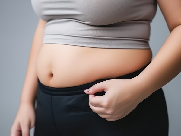 Belly of over weight woman who needs to start taking diet pills