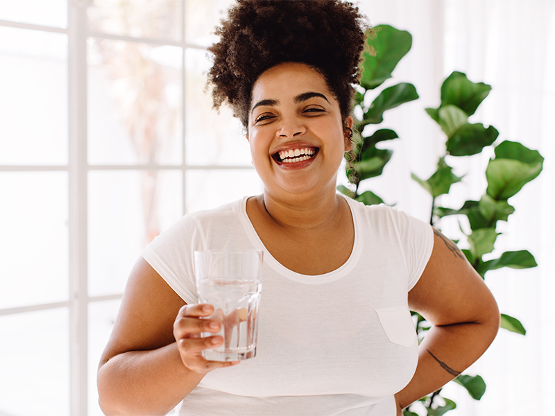 Woman drinking water to help lose weight