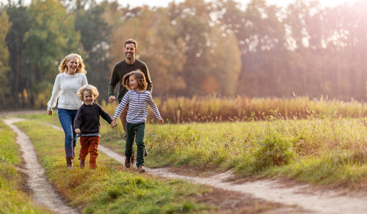 family walking in countryside