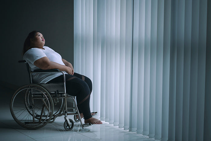 Overweight woman in wheelchair