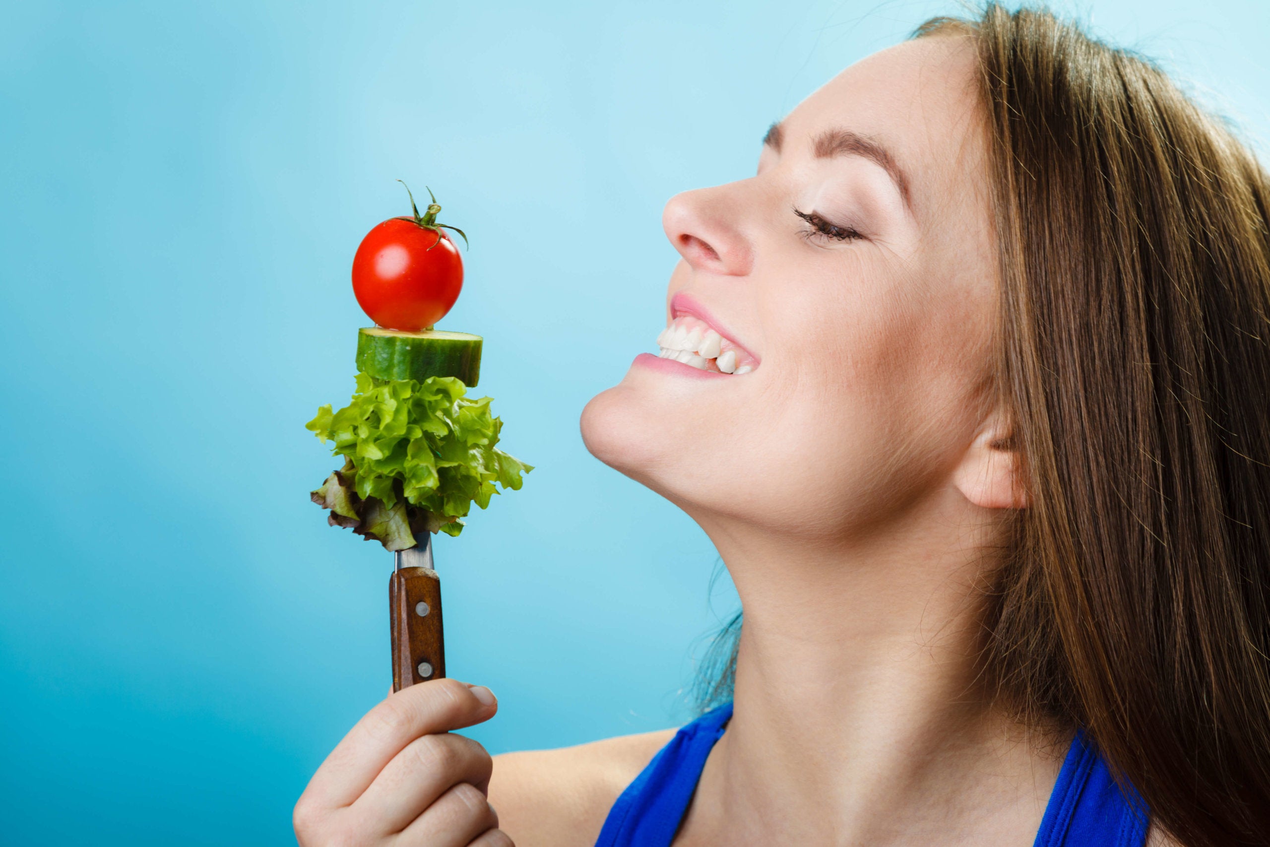 Woman eating salad