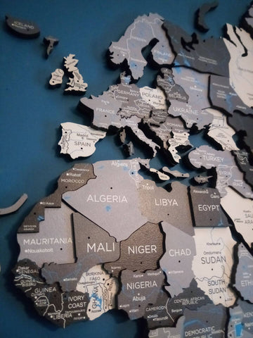 A closeup of a 3D Wooden World Map in color Nordik