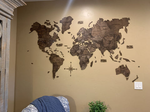 3D Wooden World Map in Dark Walnut Color in a Living Room