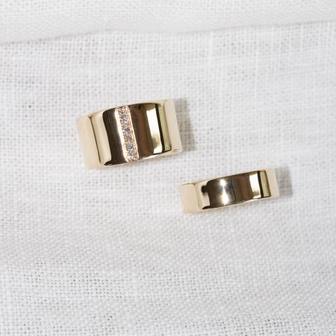 Bespoke pair of wedding bands in 9kt gold and diamonds by jewellery brand Skomer Studio