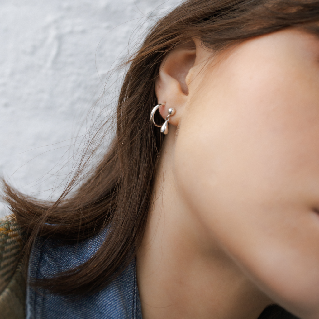 Mini Everyday Hoop Earrings and Mini Teardrop Stud Earrings in silver - hoop earring layering jewellery trend