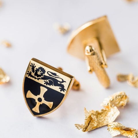 Close up of Newcastle University gold plated cuff links