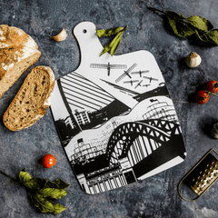 Melamine chopping board with black and white design featuring landmarks from Newcastle & Gateshead