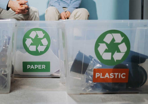 2 people recycling paper and cardboard