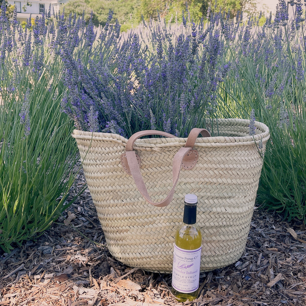 Basket of freshly harvested lavender next to bottle of Sonoma Syrup Co. Lavender Infused Simple Syrup