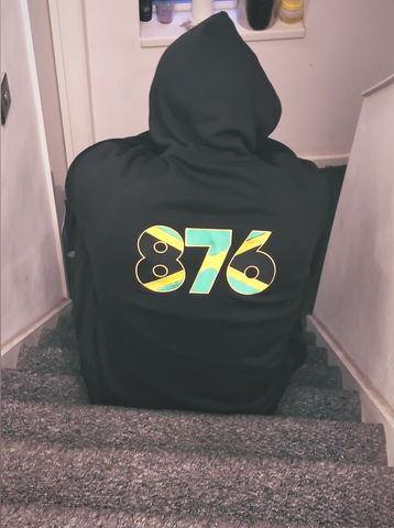 Shemalah in Black Premium Hoodie with the 876 Jamaica Dial Code Embroidery