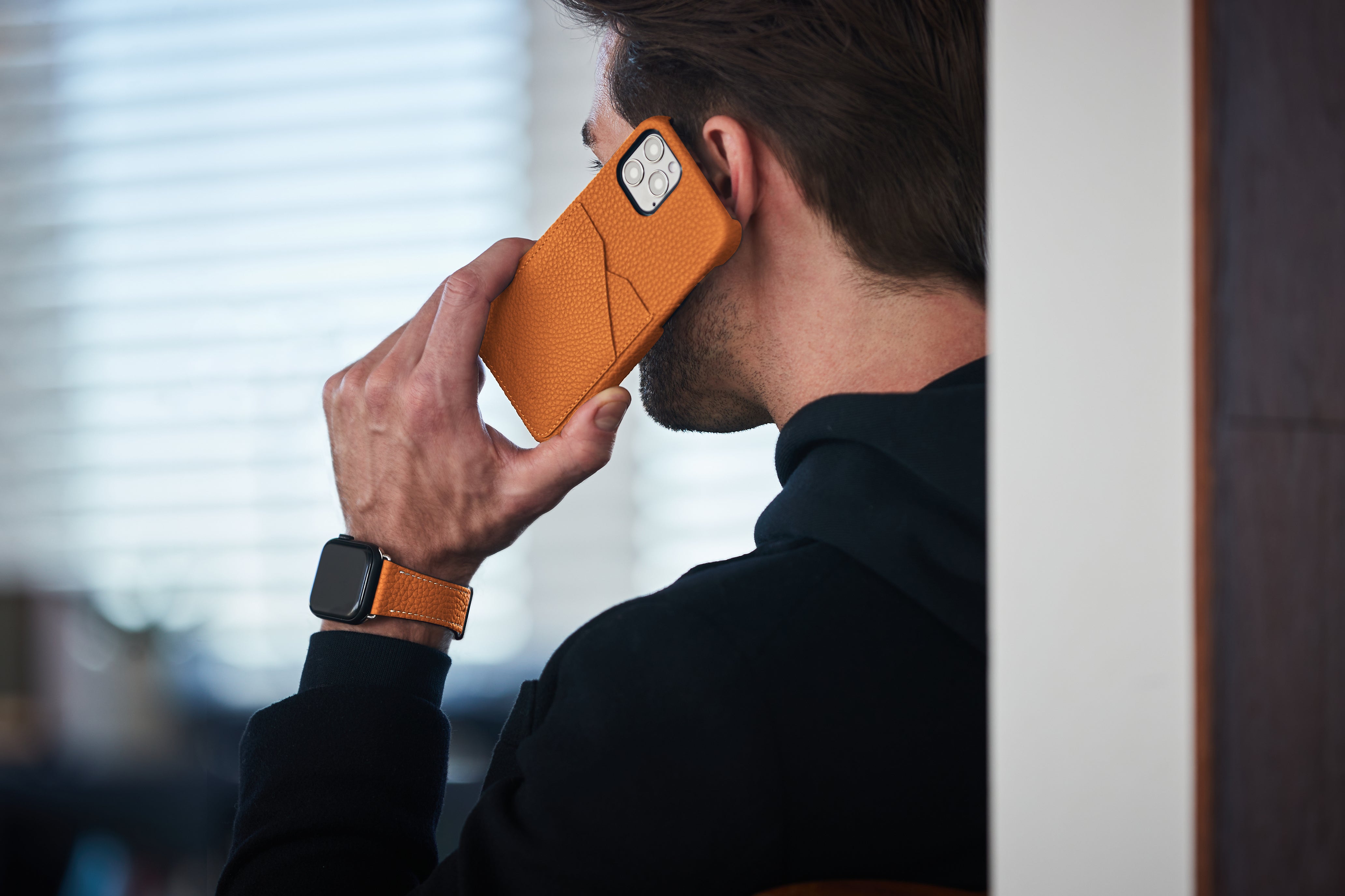 Modern and colorful iPhone case in the 2023 trend color orange.