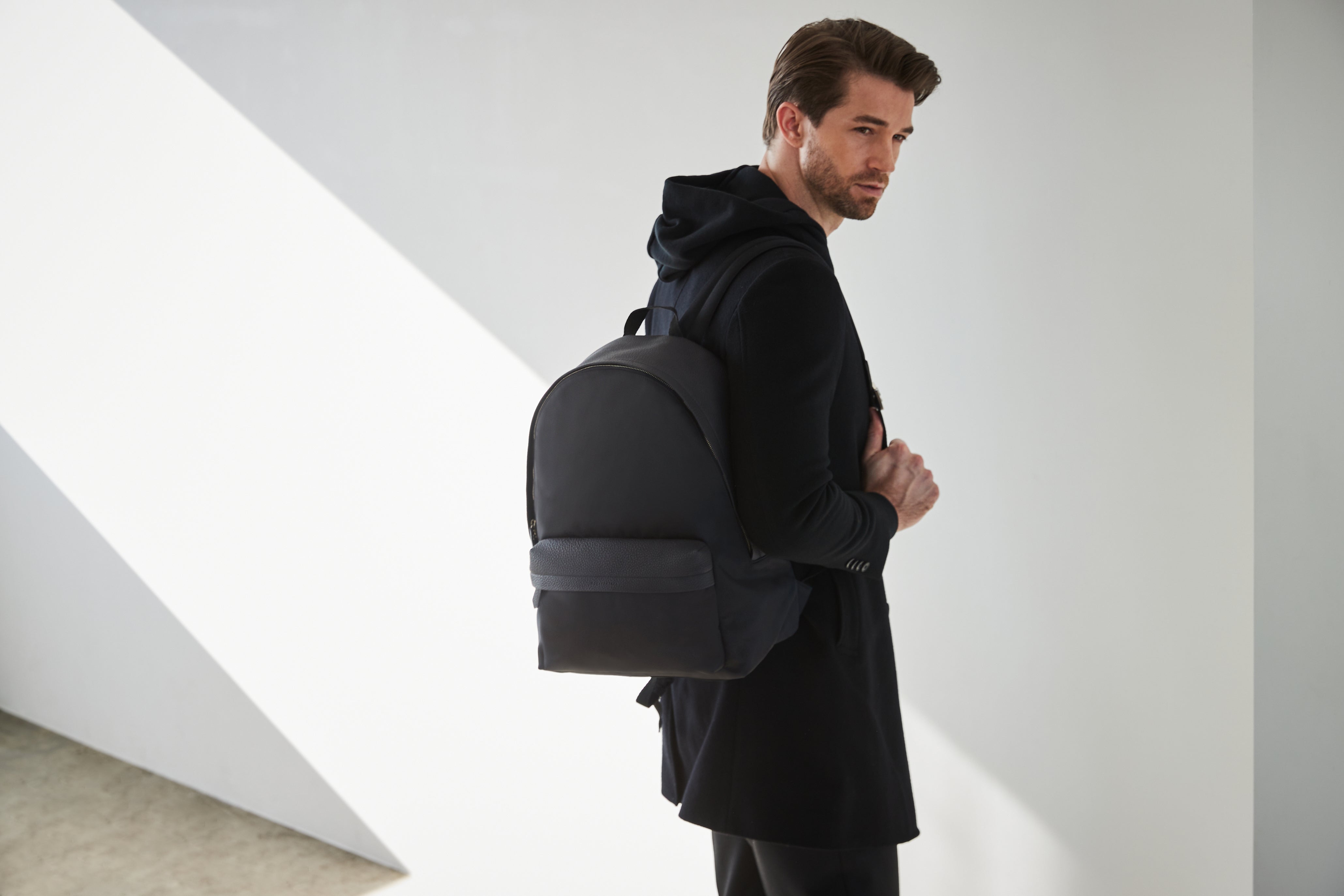 Style-conscious man wears a BONAVENTURA backpack.