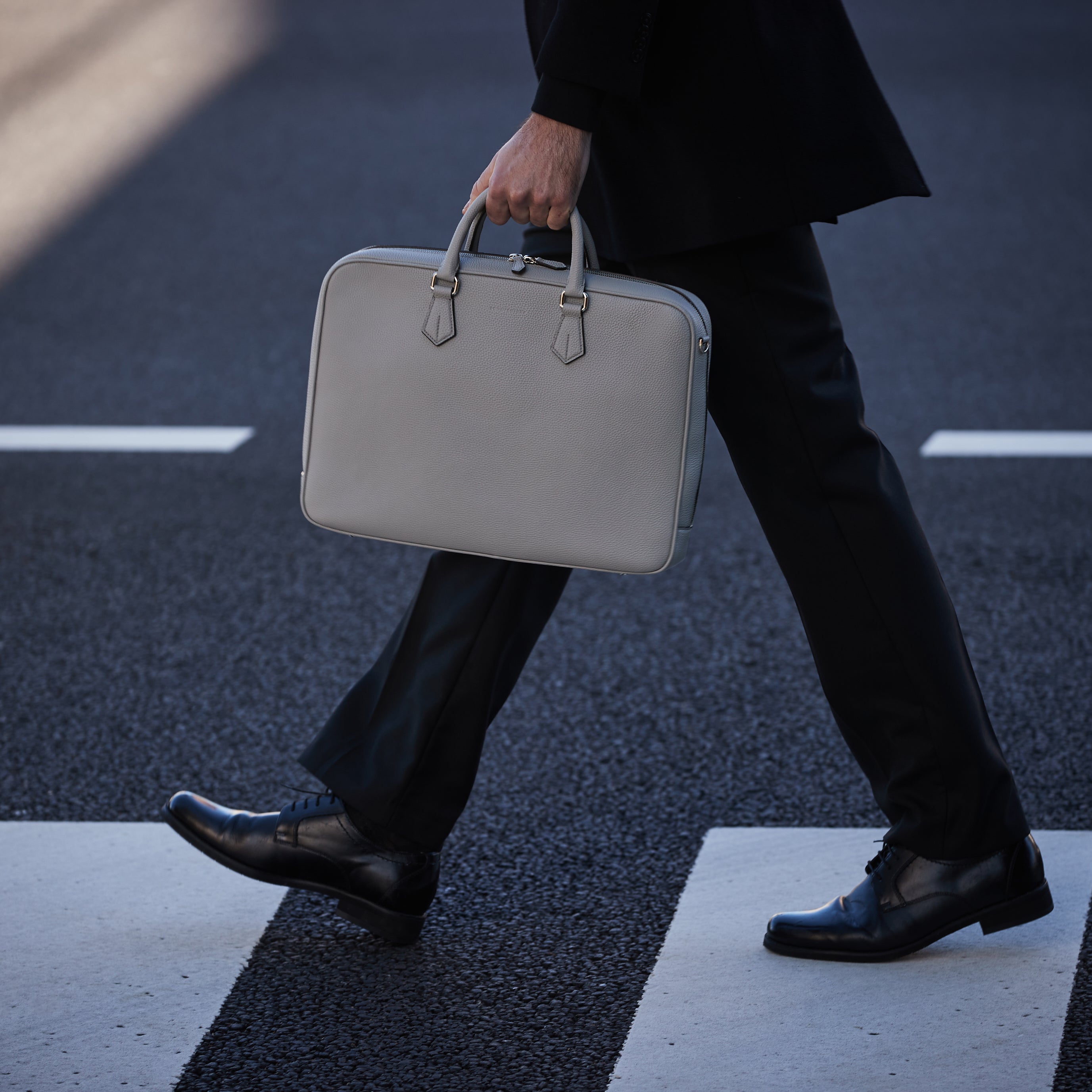 Stylish men's briefcase made of high-quality leather in a professional ambience