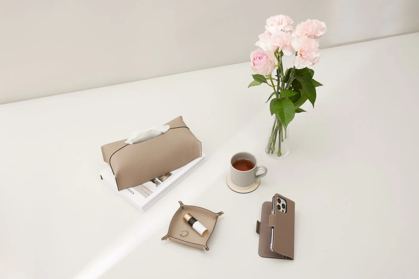 An assortment of BONAVENTURA leather products elegantly presented on a table.