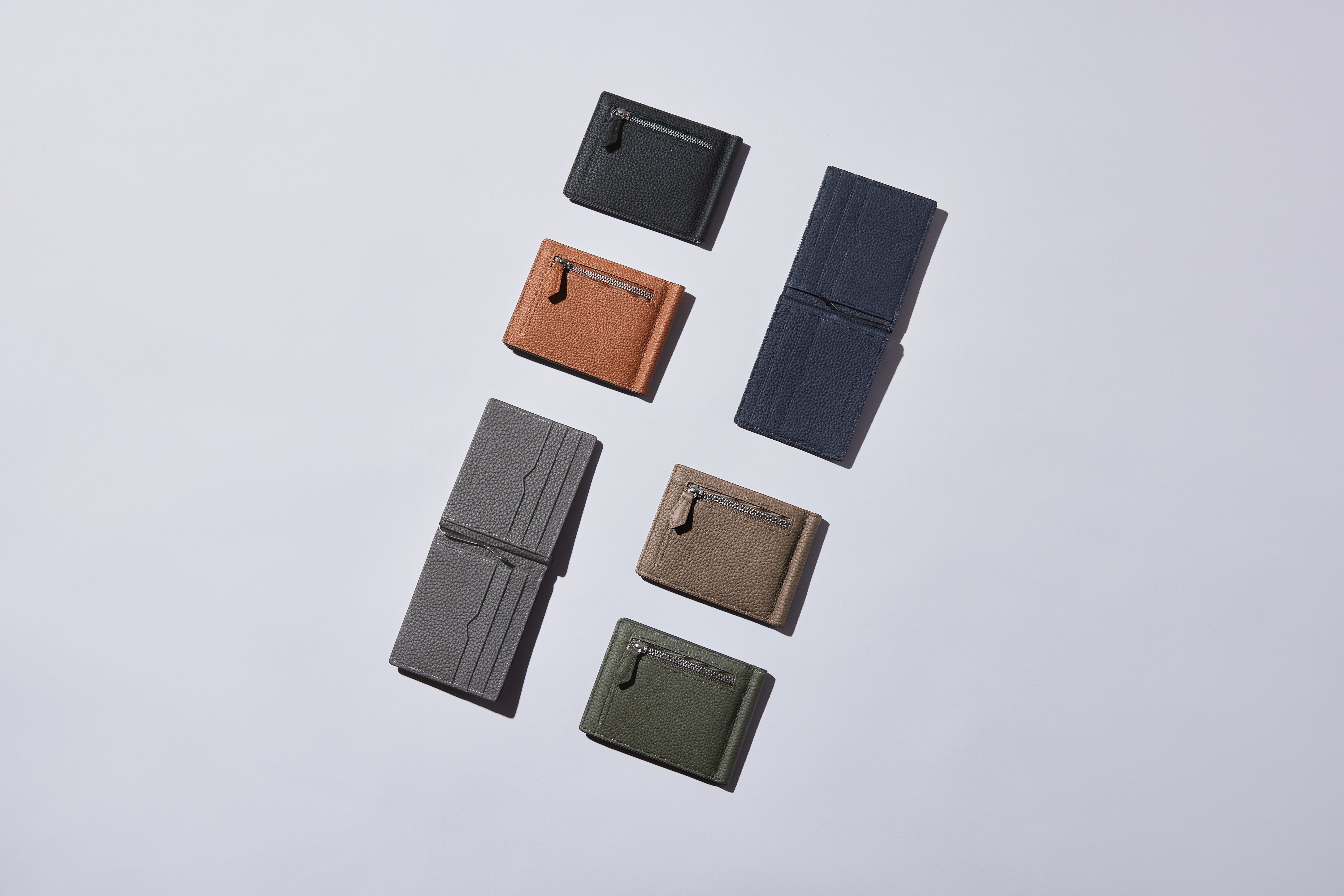 A wide selection of men's leather wallets in a variety of colors.