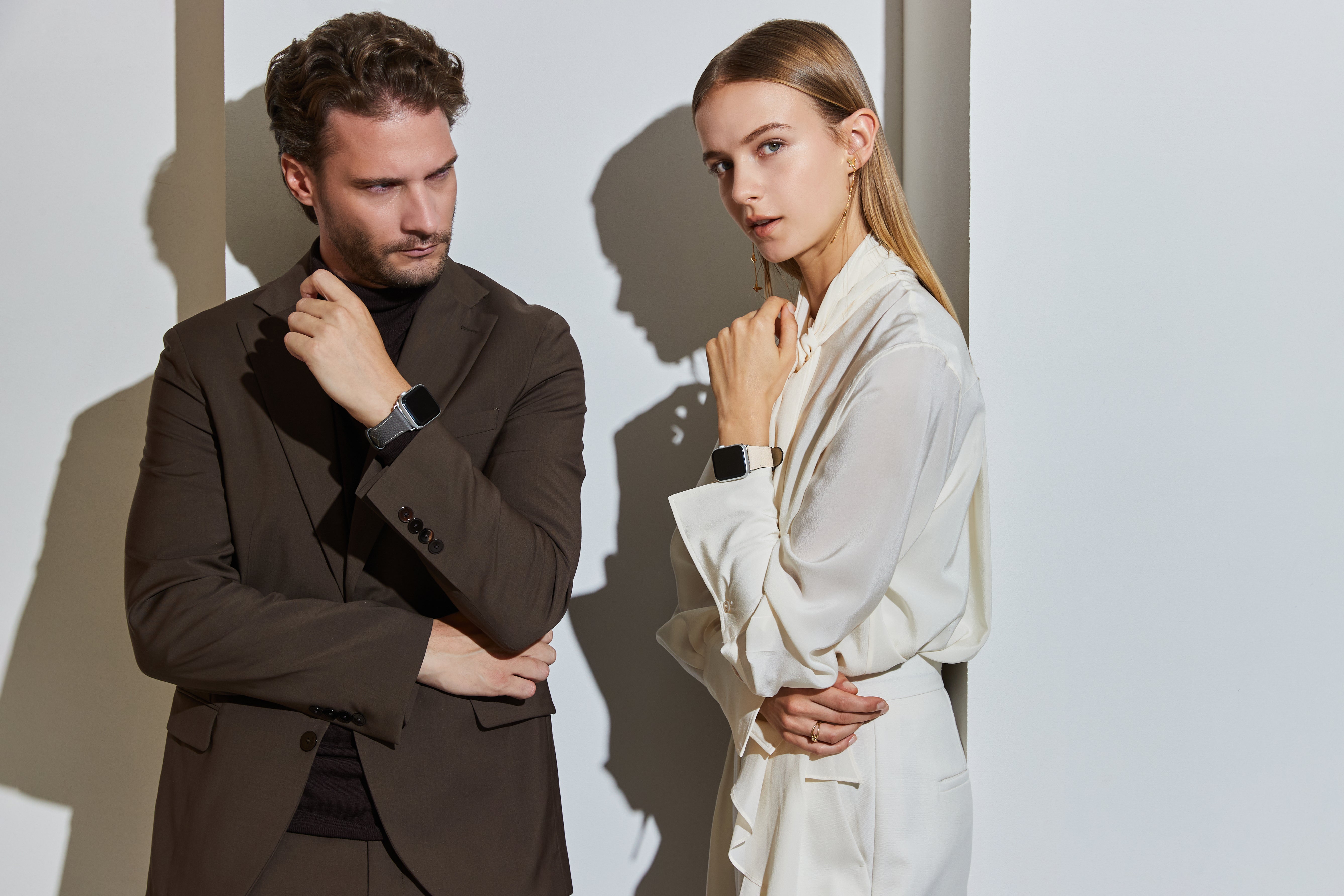 Male and female business people in elegant and stylish business attire presenting BONAVENTURA accessories such as Apple Watch Bands.