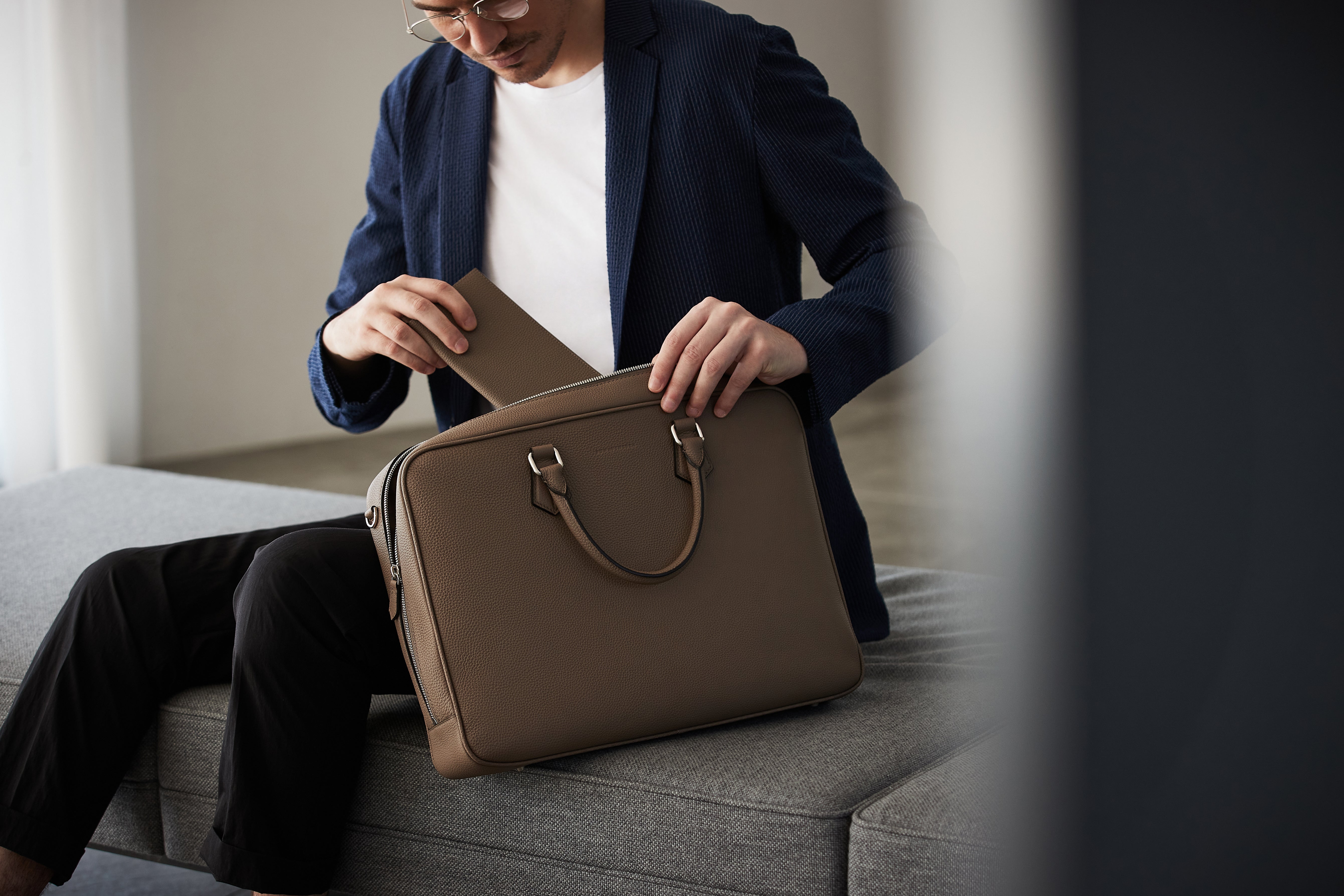 Businessman with BONAVENTURA briefcase in the office.