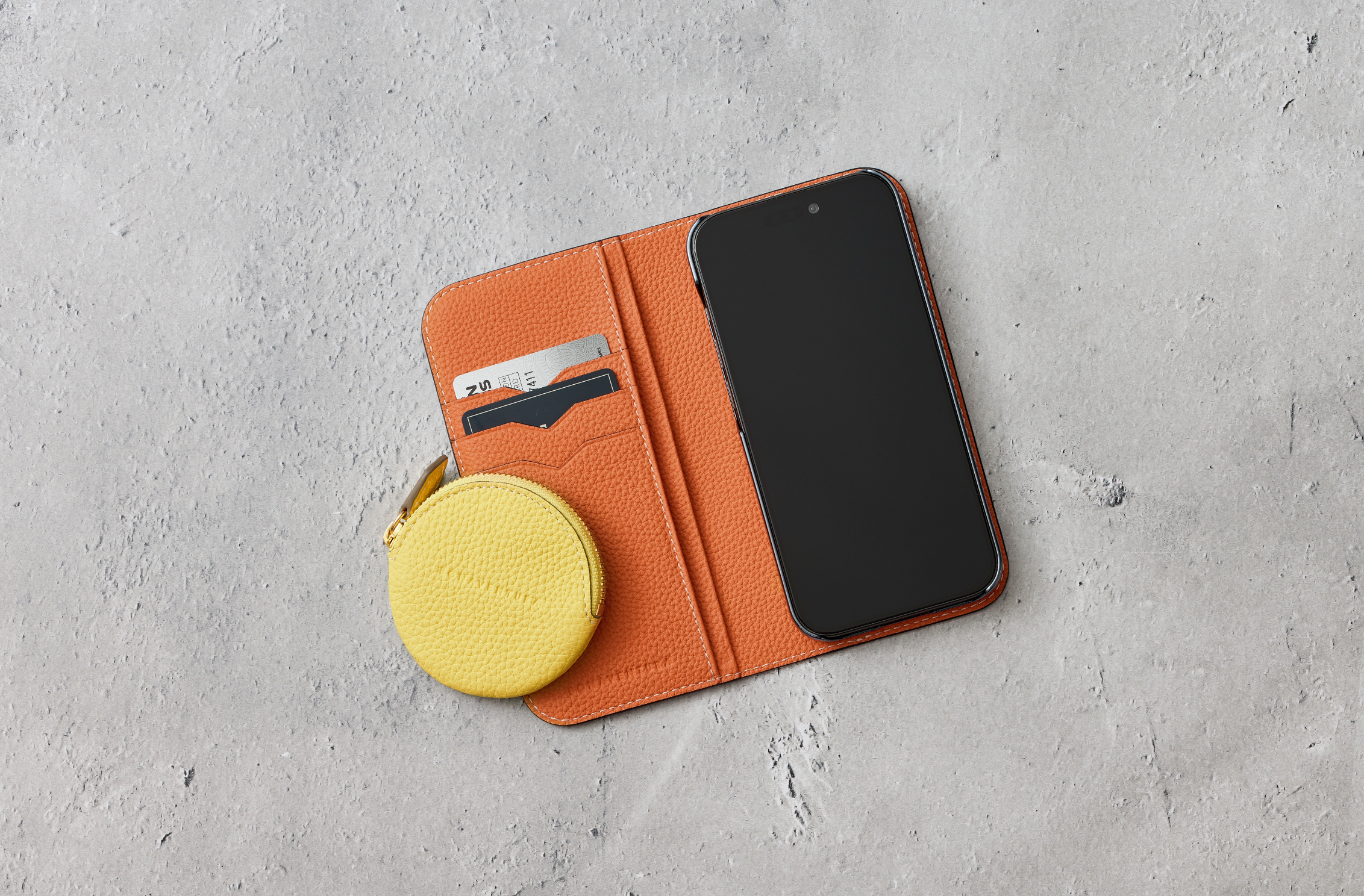 Stylish iPhone leather cases in summery colors with summer accessories.