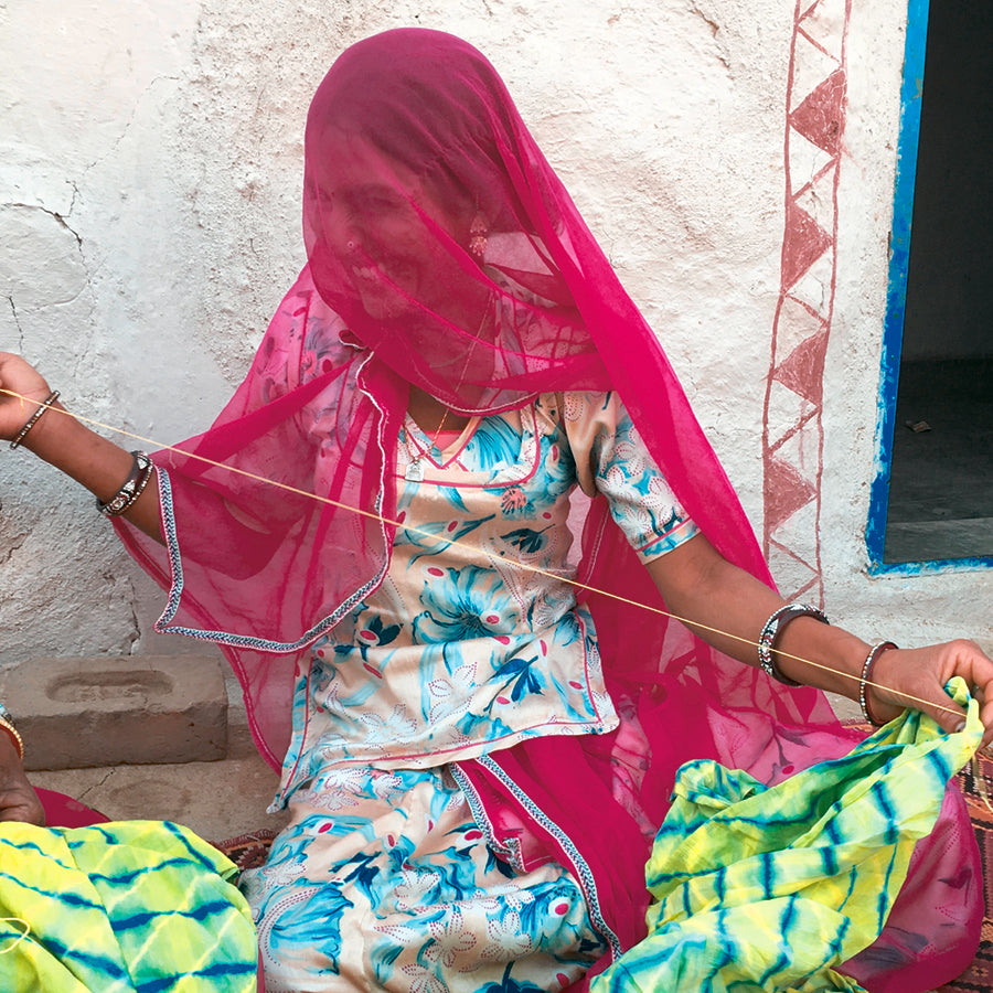 Indian woman sewing embroidery