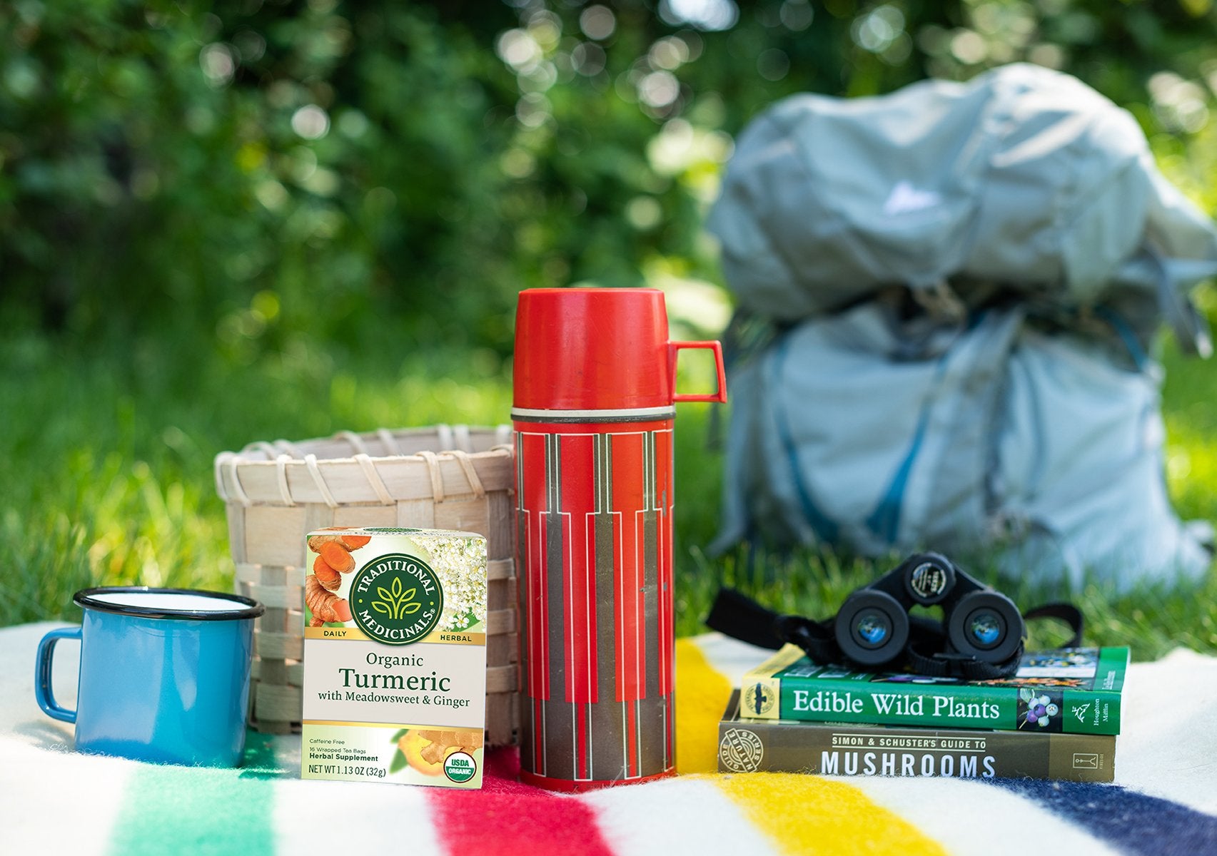 Turmeric with Meadowsweet & Ginger tea next to summer camping essentials