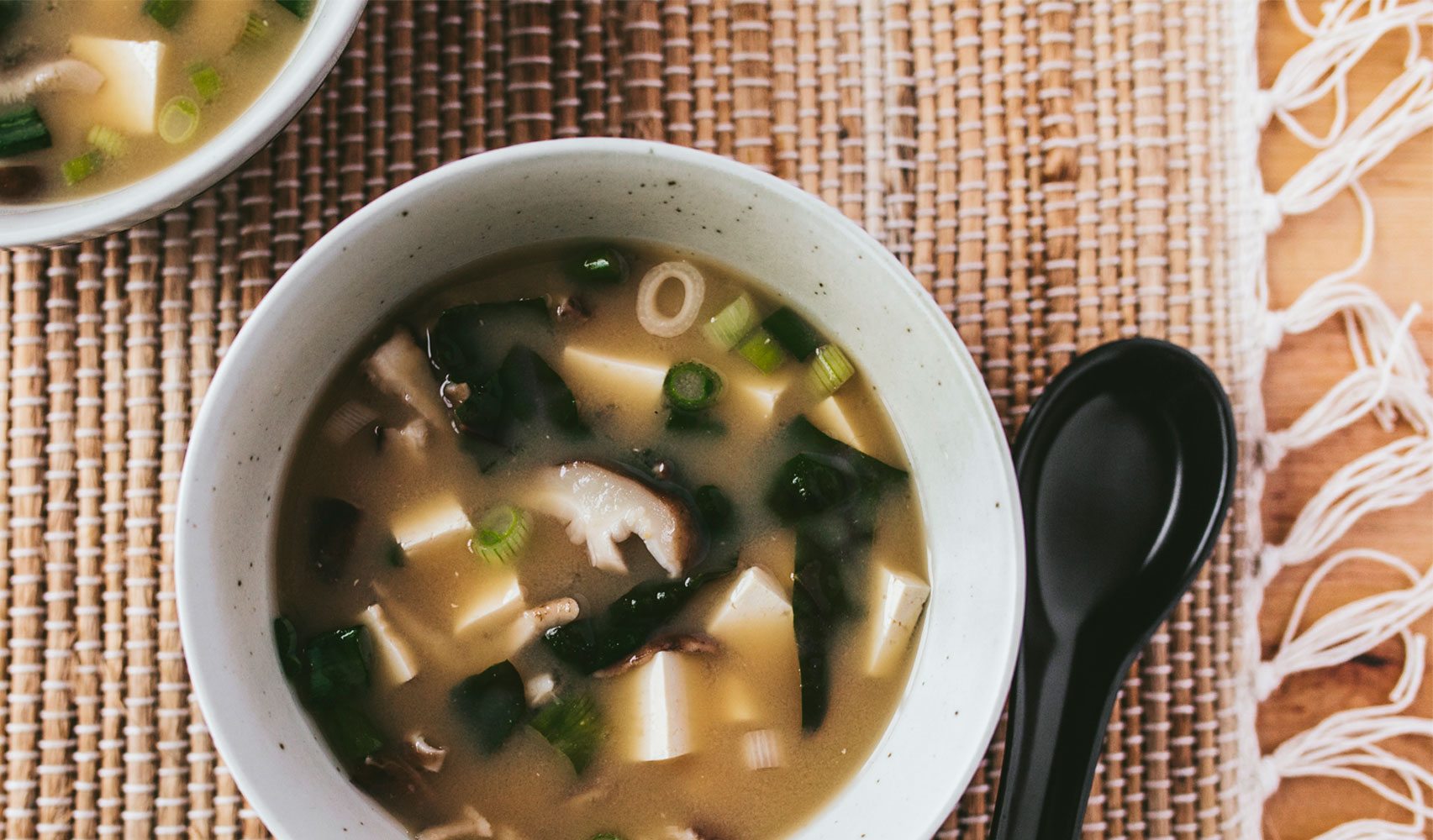 astragalus miso soup with spoon
