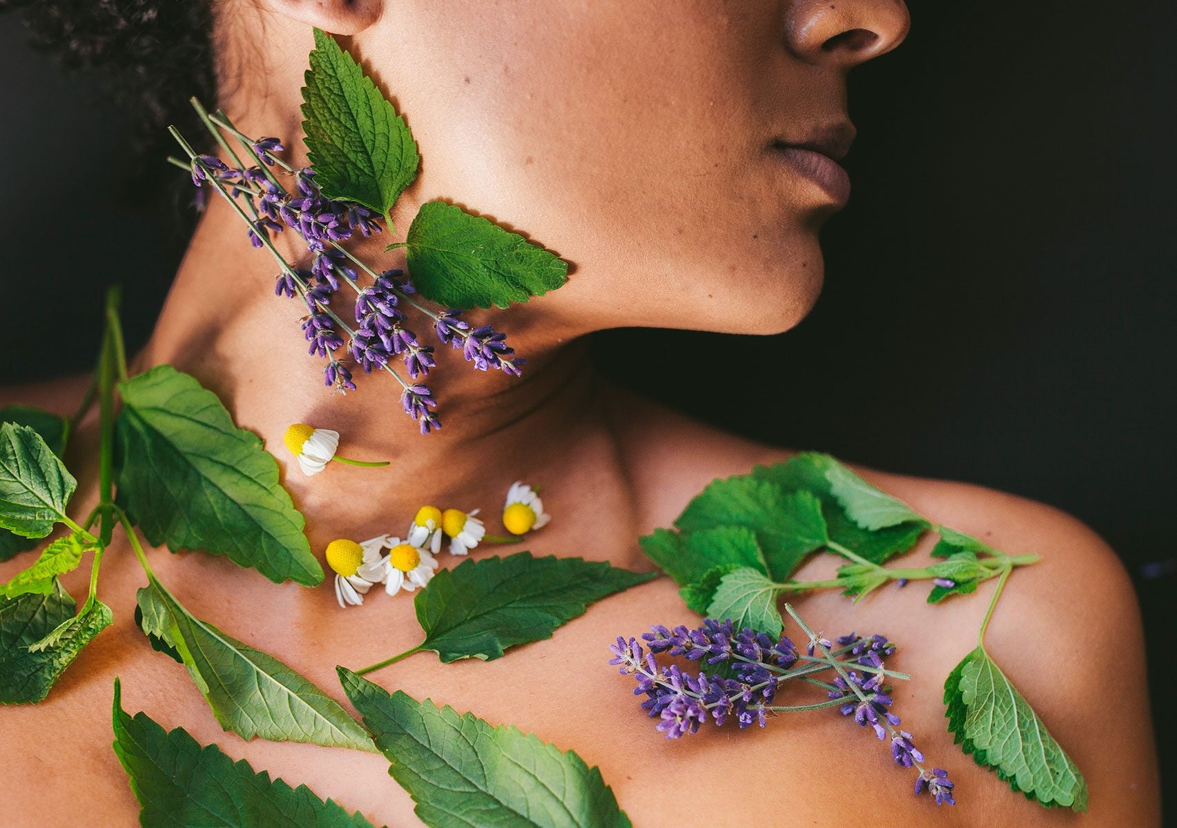herbs placed onto neck