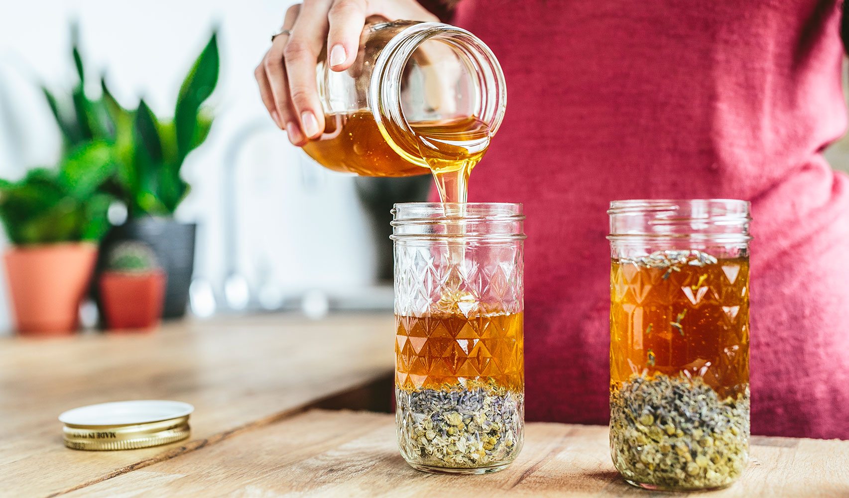 woman pouring honey