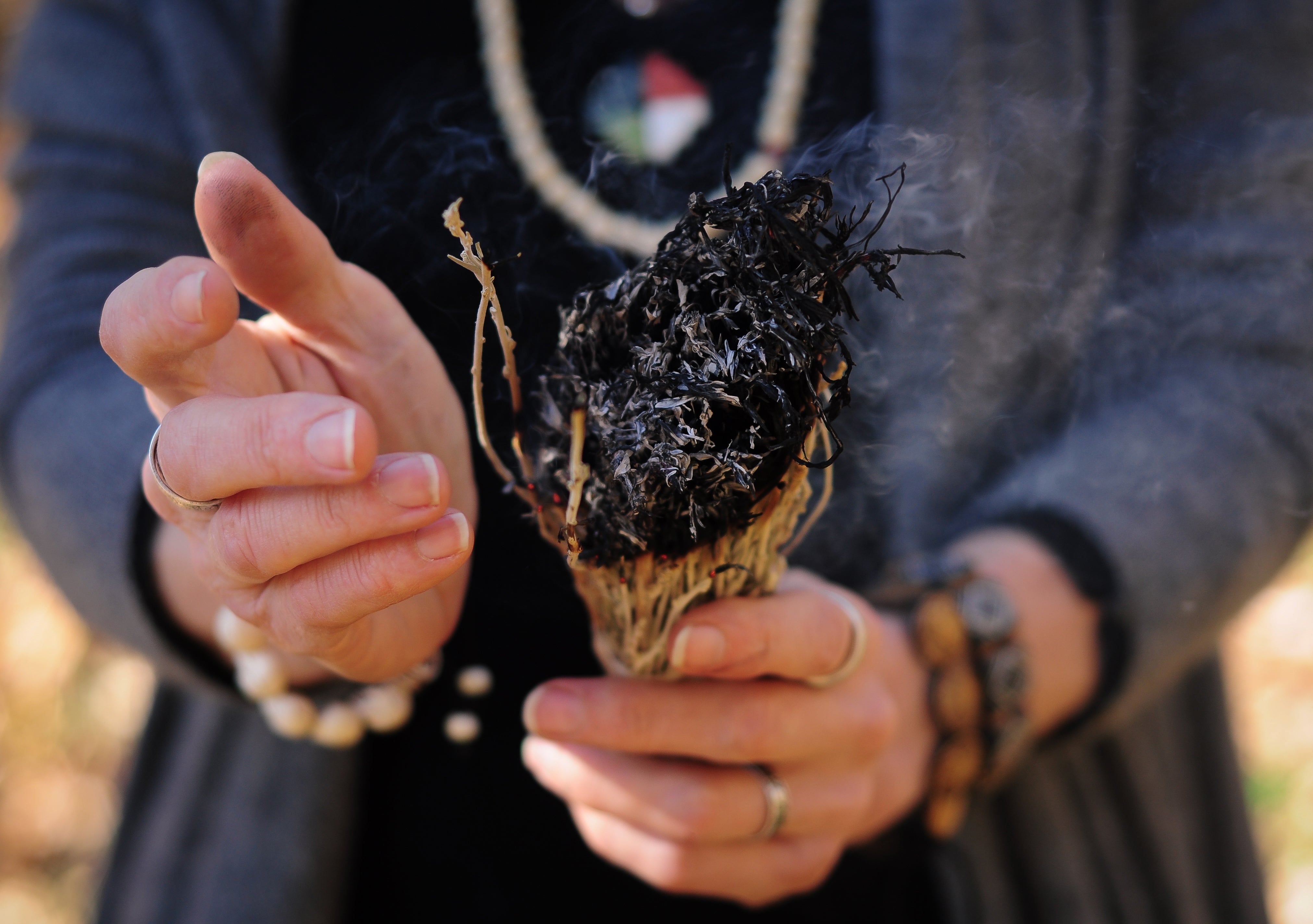 Woman holding smudge stick