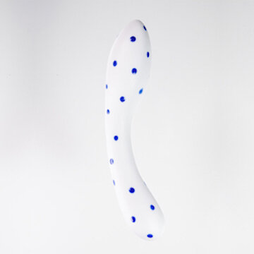 A white ceramic sex toy with bright blue dots in front of a white background.