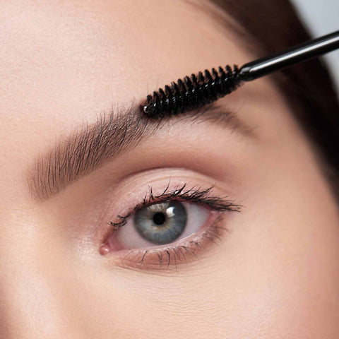 A closeup photo of a person applying The Simple Brow
