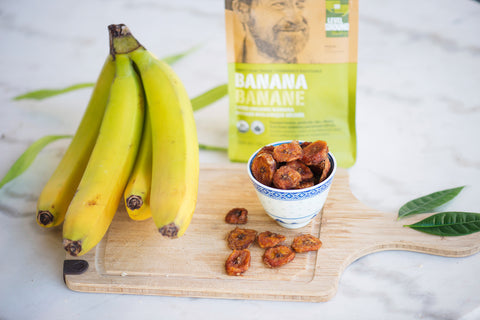 Organic dried banana, 130g package, fresh banana on cutting board  