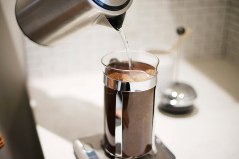 French press brewing coffee in kitchen