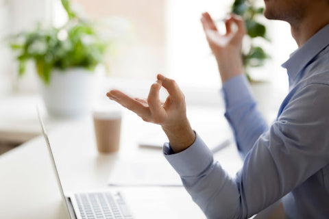 How Do All These Factors Add Up? Woman forming a meditative formation with her fingers. 