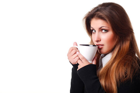 Before You Drink Kava …, Woman holding a mug of kava after taking a sip. 