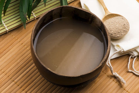 What Are the Benefits of Overcoming Reverse Tolerance? Ground kava sitting in wooden bowls and spoons.