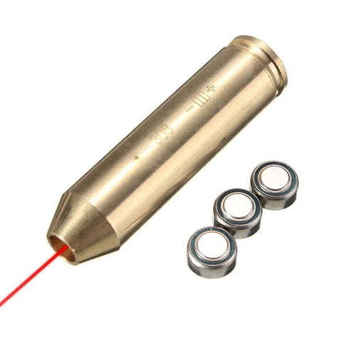 Bullseye bore sighter with batteries next to it