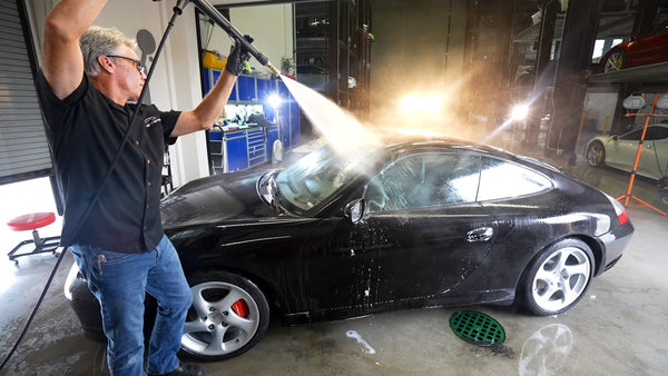 Derek Bemiss washing Porsche Carrera 996