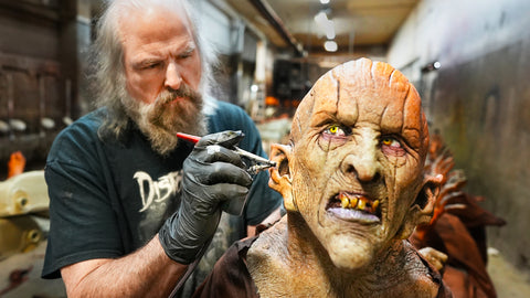Ed Edmunds of Distortions Unlimited painting the Pumpkin Witch Halloween prop