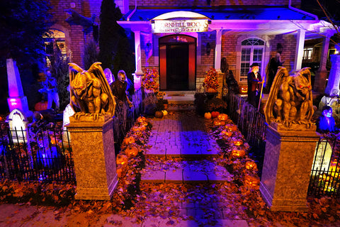 Haunted house yard haunt decorated at night for the Halloween season