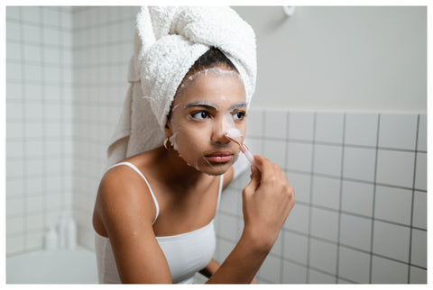Woman using a Microfiber Towel and doing Skincare routine