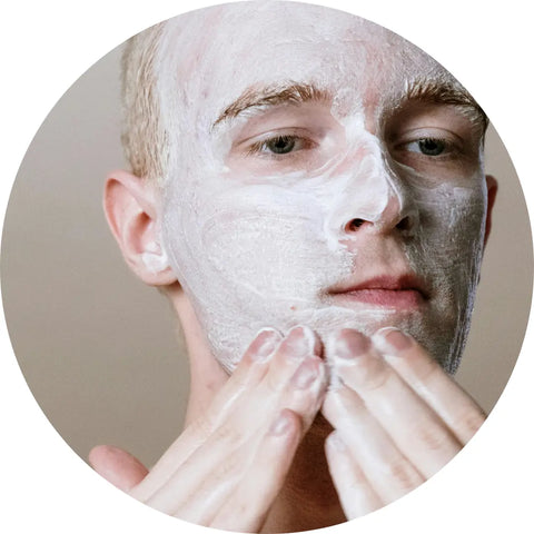 man facial scrubbing his face