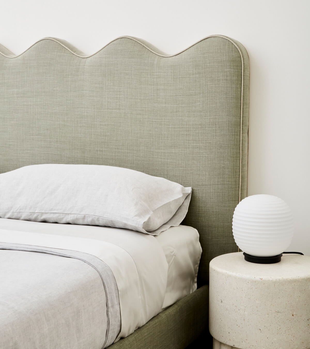 Wave Piped Fully Upholstered Bed – pictured in Tussock with contrast Birch piping.
